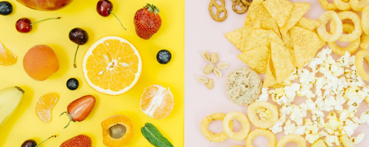 Left: fresh fruits on yellow—fruits as a snack; right: assorted healthy snacks like chips, popcorn, and pretzels on pink. | Emping SG