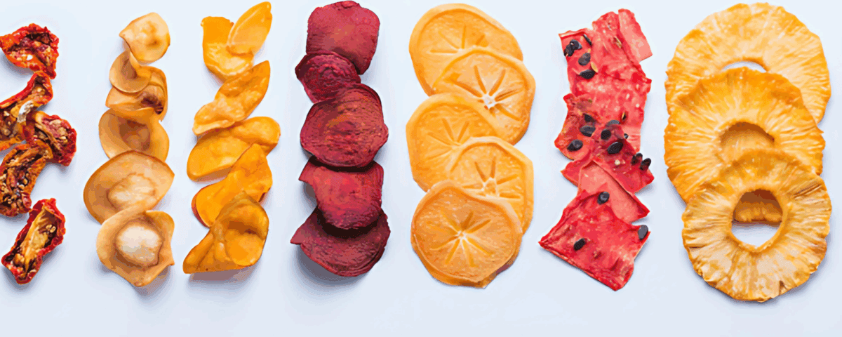 Rows of assorted dried fruits, a healthy snack packed with fiber, including tomato, apple, mango, and more on a white background. | Emping SG