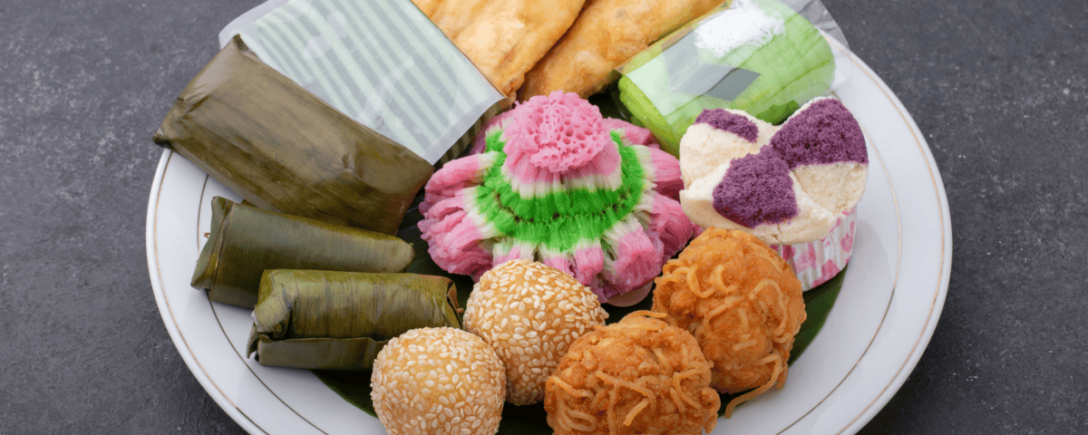 A white plate with authentic Indonesian snacks—assorted fried, steamed, and wrapped treats with timeless appeal. | Emping SG