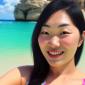 Smiling woman with long black hair taking a selfie on a sunny beach with turquoise water and rocky cliffs in the background, sharing her glowing testimonial of the serene beauty. | Emping SG